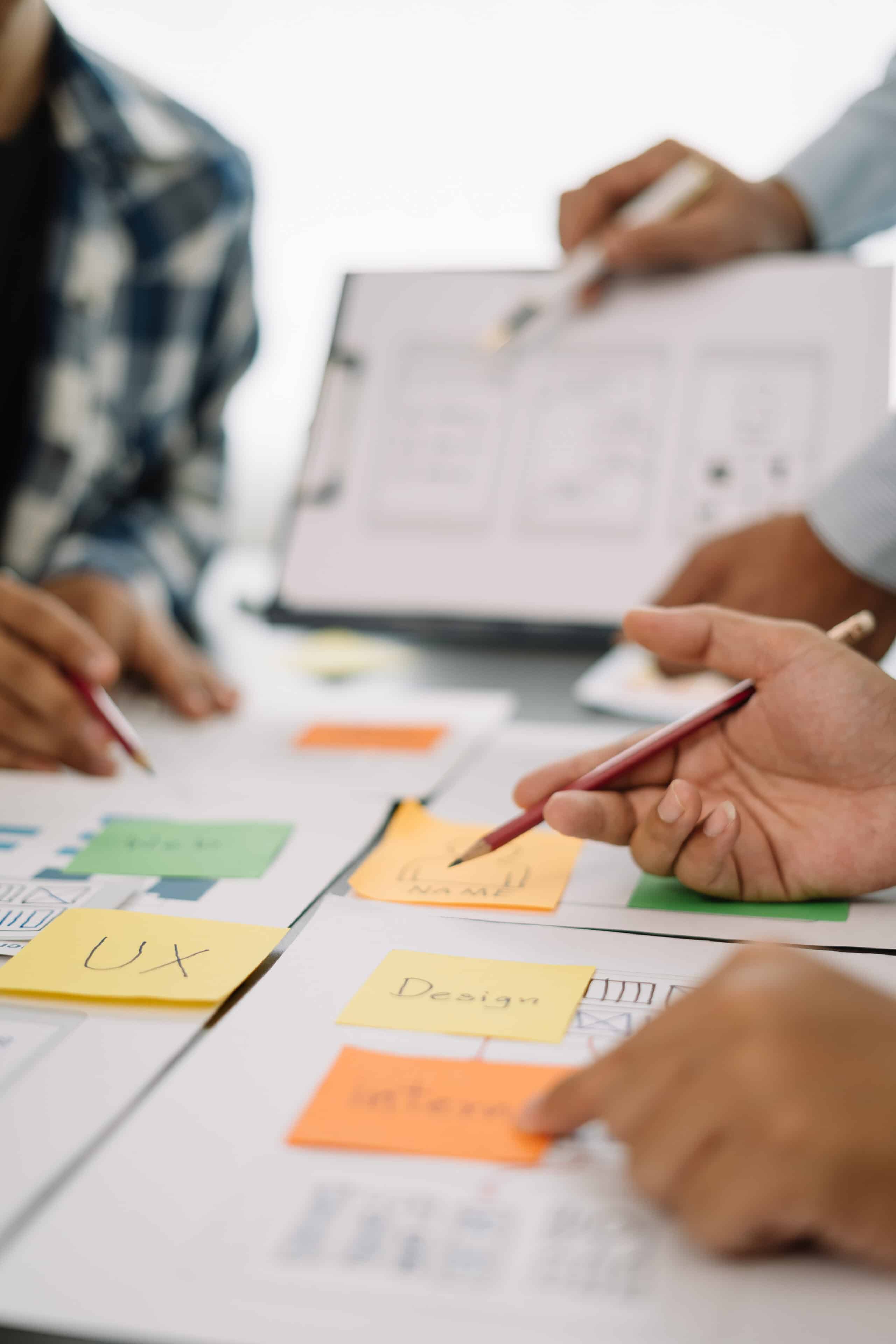 Creative male web designer planning application development for web mobile phone